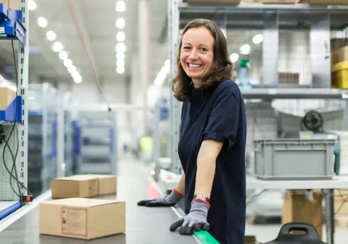 A woman tracking packages as they are scanned by Cubing Systems